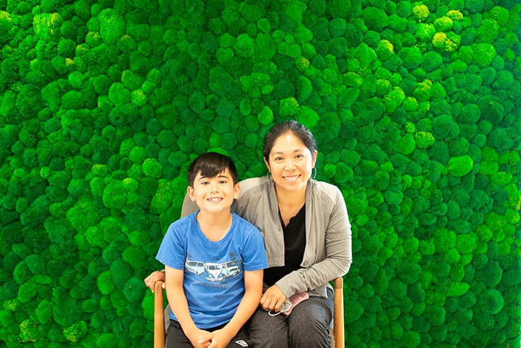 Mother and child smiling in waiting room