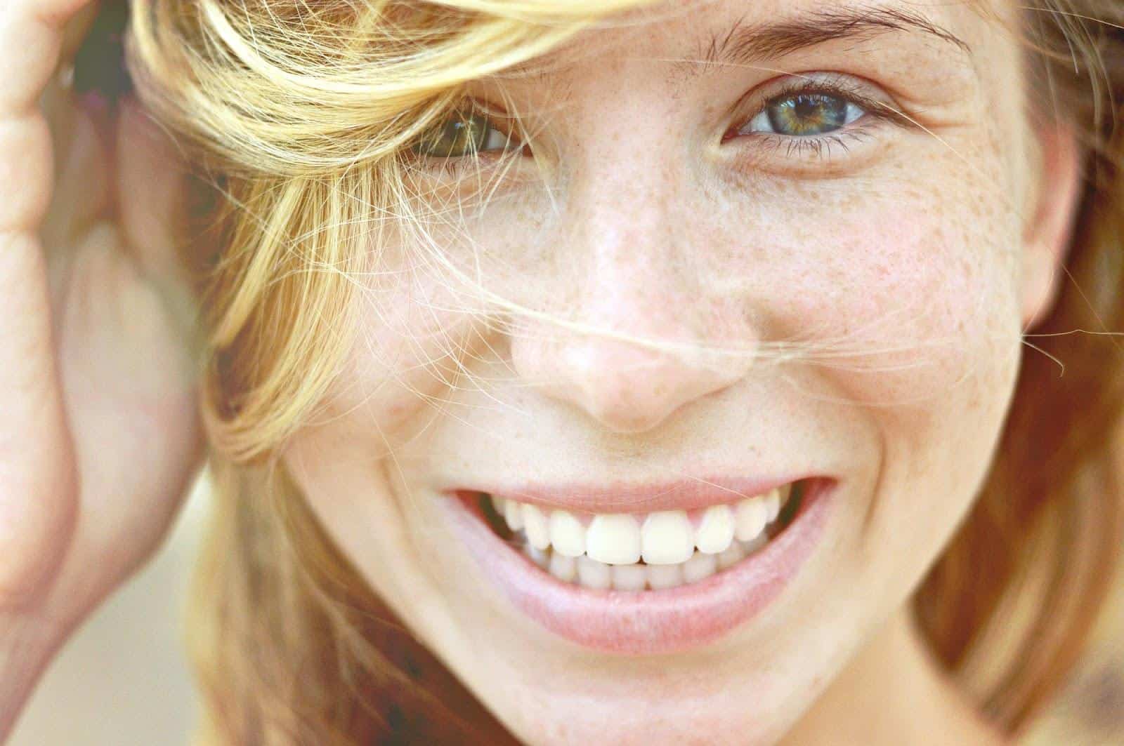 Close-up of a woman's smiling face.