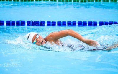 A person swimming in a pool.