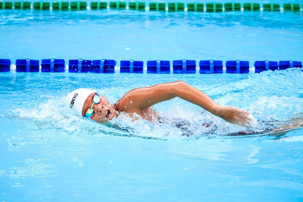 A person swimming in a pool.