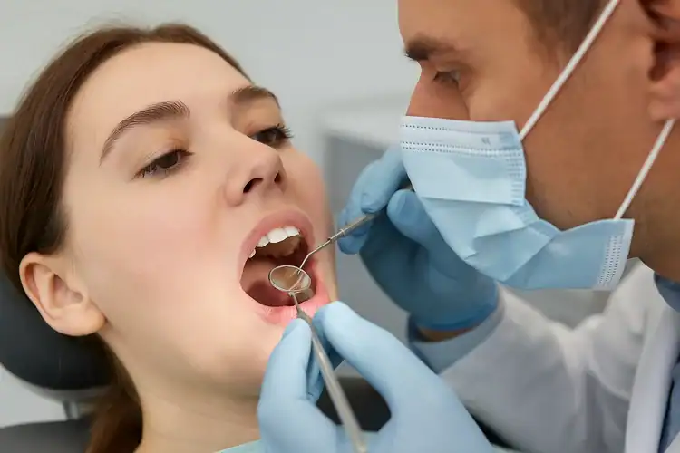 A picture of a dentist examining Tooth Pain After Filling