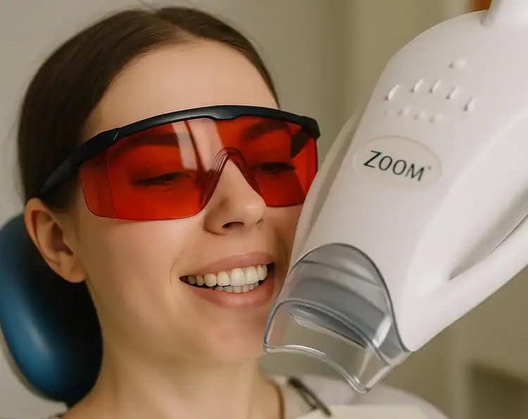 A picture of a woman getting teeth whitening procedure