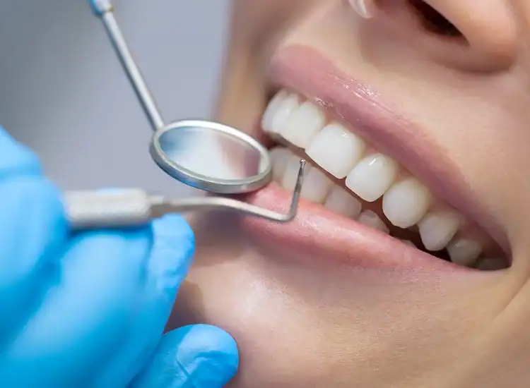 A picture of a dentist examining the dental filling