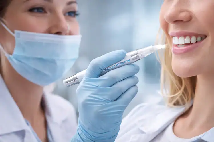 A picture of a dentist and her whitening pen