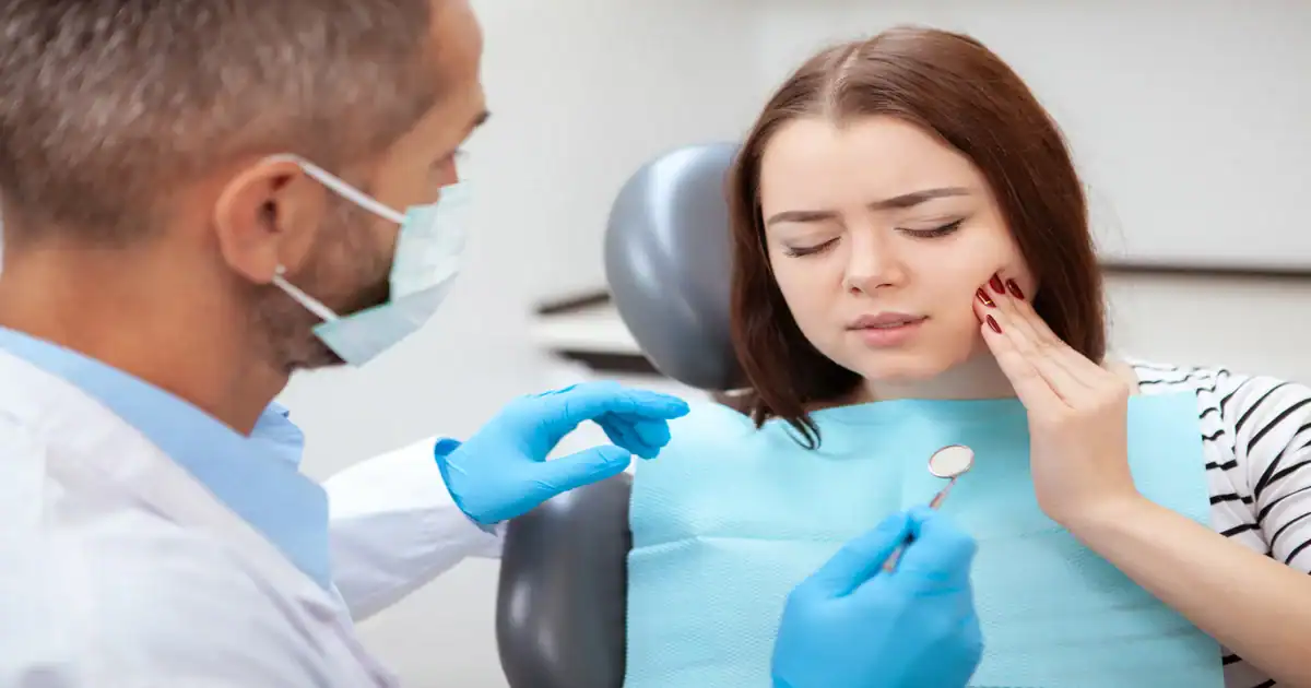 A picture of a woman with dental emergency